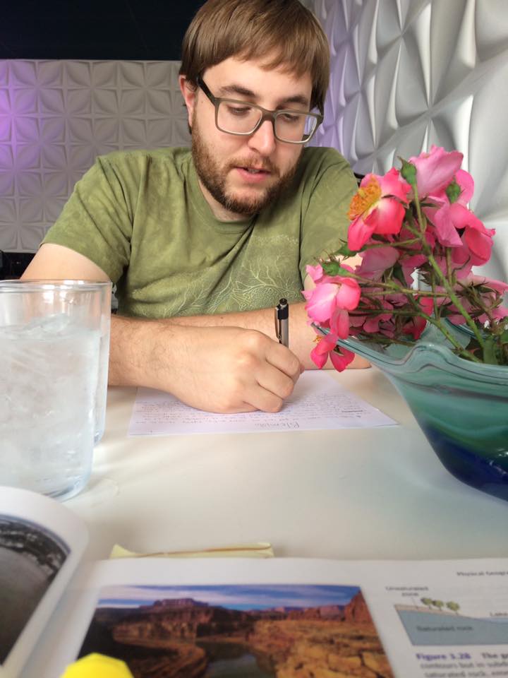 Randal Eldon Greene writing at the Blue Cafe in Sioux City Iowa.