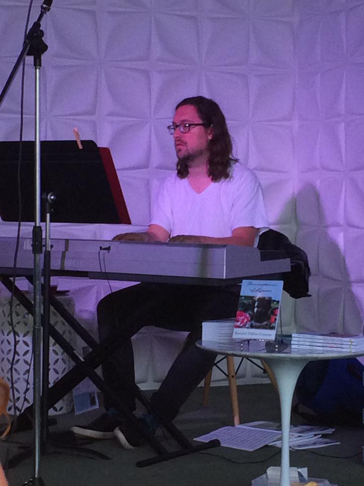 Jazz pianist at Randal Eldon Greene's book signing for his debut novel Descriptions of Heaven.