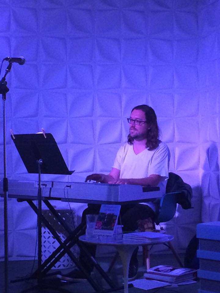 Jazz pianist at Randal Eldon Greene's book signing for his debut novel Descriptions of Heaven.