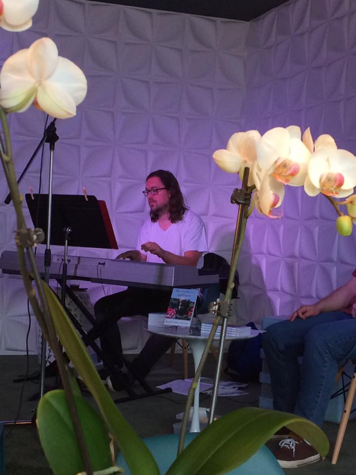 Jazz pianist at Randal Eldon Greene's book signing for his debut novel Descriptions of Heaven.
