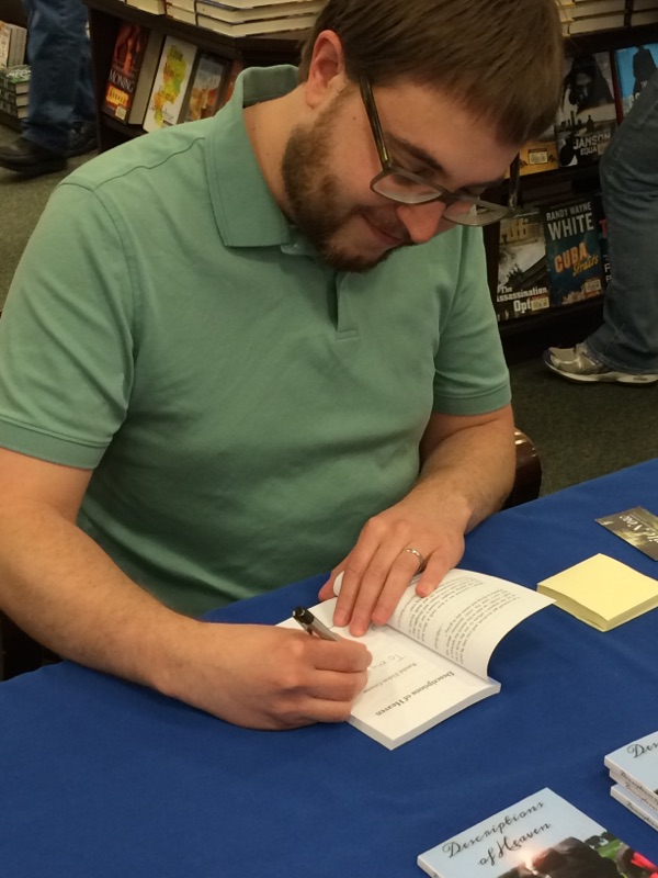Literary Fiction author Randal Eldon Greene signing his debut book Descriptions of Heaven.
